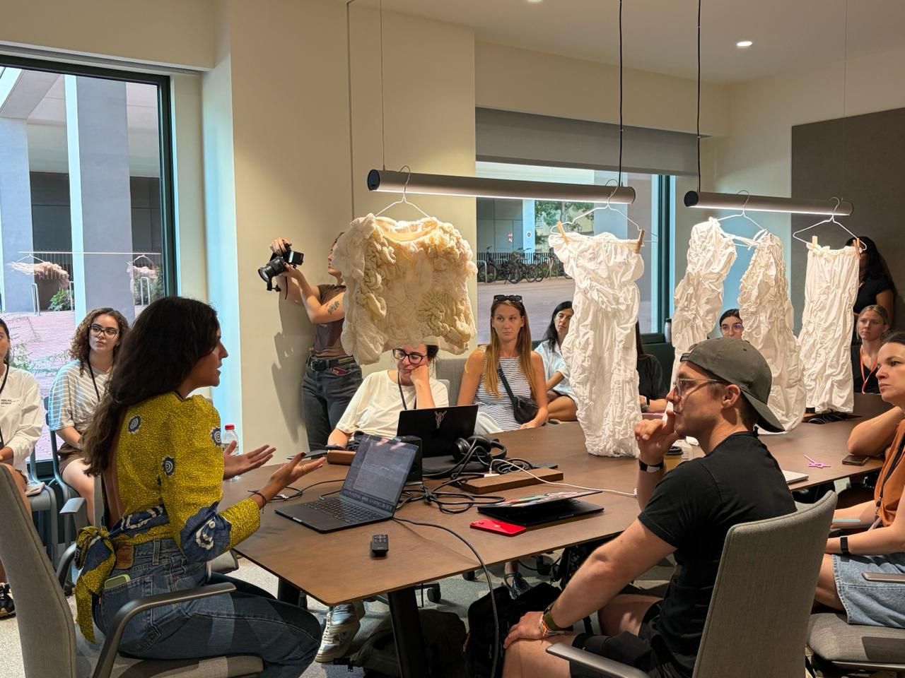 The AI Fashion Studio with Lumoo, a designer's collection in the room